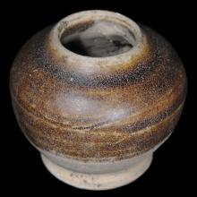 Small maroon enameled-sandstone vessel